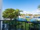 Stunning water view from private balcony, showcasing boats and lush landscaping at 749 Freeling Dr, Sarasota, FL 34242