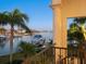 Boat lift and peaceful waterfront view at sunset at 749 Freeling Dr, Sarasota, FL 34242