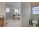 Elegant bathroom with soaking tub, shower, and double vanity at 12086 Granite Woods Loop, Venice, FL 34292