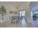 Elegant dining room with a table and six chairs at 12086 Granite Woods Loop, Venice, FL 34292