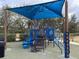 Community playground with shaded play area at 12086 Granite Woods Loop, Venice, FL 34292