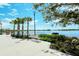 Relaxing lakeside walkway with a bench, offering scenic views at 12140 Wellen Golf St # 404, Venice, FL 34293