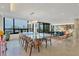 Modern dining room showcasing a glass-top table and city views at 1255 N Gulfstream Ave # Ph1501, Sarasota, FL 34236