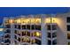 Night view of building showcasing illuminated upper floor balconies at 1255 N Gulfstream Ave # Ph1501, Sarasota, FL 34236