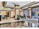 Elegant lobby with seating area and grand piano at 1255 N Gulfstream Ave # Ph1501, Sarasota, FL 34236