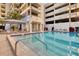 Refreshing community pool with surrounding lounge chairs at 1255 N Gulfstream Ave # Ph1501, Sarasota, FL 34236