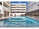 Inviting swimming pool with surrounding lounge chairs at 1255 N Gulfstream Ave # Ph1501, Sarasota, FL 34236