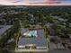 Aerial view of a property with a pool and surrounding houses at 2069 Bougainvillea St, Sarasota, FL 34239