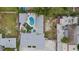 Aerial view showing house, pool, and surrounding area at 2069 Bougainvillea St, Sarasota, FL 34239