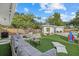 Large backyard with a pool, firepit, and artificial turf at 2069 Bougainvillea St, Sarasota, FL 34239