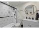 Modern bathroom with geometric tile and a large mirror at 2069 Bougainvillea St, Sarasota, FL 34239