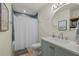 Clean bathroom with a bathtub and a light teal vanity at 2069 Bougainvillea St, Sarasota, FL 34239