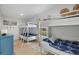 Bedroom with a bunk bed and a twin bed, view of backyard at 2069 Bougainvillea St, Sarasota, FL 34239