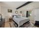 Main bedroom with king-size bed and artwork at 2069 Bougainvillea St, Sarasota, FL 34239