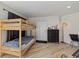 Small bedroom with a bunk bed and dresser at 2069 Bougainvillea St, Sarasota, FL 34239
