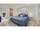 Spacious bedroom with a king-size bed and light wood floors at 2069 Bougainvillea St, Sarasota, FL 34239