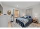 Bedroom with a queen-size bed, dresser, and light wood floors at 2069 Bougainvillea St, Sarasota, FL 34239
