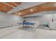 Finished basement with ping pong table and storage at 2069 Bougainvillea St, Sarasota, FL 34239