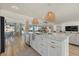 Open concept kitchen with white cabinets and a large island at 2069 Bougainvillea St, Sarasota, FL 34239