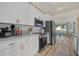 Bright kitchen with white cabinets, stainless steel appliances, and an island at 2069 Bougainvillea St, Sarasota, FL 34239
