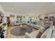Large living room with sectional sofa, game station and wood floors at 2069 Bougainvillea St, Sarasota, FL 34239