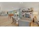 Living area with fireplace, seating, and view of game room and backyard at 2069 Bougainvillea St, Sarasota, FL 34239