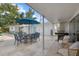 Outdoor patio with seating, umbrella, and grill at 2069 Bougainvillea St, Sarasota, FL 34239