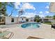 Beautiful kidney shaped pool with patio and lounge chairs at 2069 Bougainvillea St, Sarasota, FL 34239