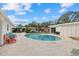 Stunning kidney-shaped pool with patio and lounge chairs at 2069 Bougainvillea St, Sarasota, FL 34239