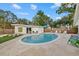 Inviting kidney-shaped pool with patio and lounge chairs at 2069 Bougainvillea St, Sarasota, FL 34239