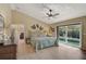 Bright bedroom with pool view and sliding glass doors at 219 Keel Way, Osprey, FL 34229