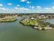 Aerial view of waterfront homes and a marina at 219 Keel Way, Osprey, FL 34229