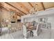 Spacious dining room features a rustic wooden table and chandelier at 3970 Prairie Dunes Dr, Sarasota, FL 34238