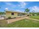 Spacious backyard with patio and large sunroom at 409 Archibald Ave, Sarasota, FL 34243
