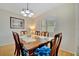Dining room with hardwood floors, a wood table, and six chairs at 409 Archibald Ave, Sarasota, FL 34243