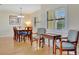 Bright dining room featuring hardwood floors and a classic dining set at 409 Archibald Ave, Sarasota, FL 34243
