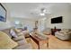 Living room with hardwood floors and comfortable seating arrangement at 409 Archibald Ave, Sarasota, FL 34243
