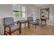 Bright living room with hardwood floors and vintage chairs at 409 Archibald Ave, Sarasota, FL 34243