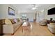 Living room with hardwood floors, comfortable seating, and access to the entryway at 409 Archibald Ave, Sarasota, FL 34243