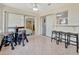 Sunroom with tiled floors, sliding doors, and access to multiple rooms at 409 Archibald Ave, Sarasota, FL 34243