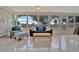 Relaxing sunroom with tiled floors, seating area, and plenty of natural light at 409 Archibald Ave, Sarasota, FL 34243