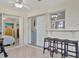 Sunroom with tiled floors, sliding doors, and bar-height seating area at 409 Archibald Ave, Sarasota, FL 34243