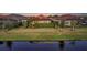 Home nestled on a tranquil waterway with lush landscaping at 4730 Zeno Ct, Bradenton, FL 34211
