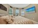 Bedroom with king bed, neutral decor, and plenty of natural light at 4730 Zeno Ct, Bradenton, FL 34211