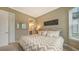 Guest bedroom with king bed and neutral decor at 4730 Zeno Ct, Bradenton, FL 34211