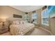 Cozy bedroom with a king-size bed, neutral decor, and plenty of natural light at 4730 Zeno Ct, Bradenton, FL 34211