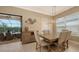 Bright dining room features a large wooden table and access to the backyard patio at 4730 Zeno Ct, Bradenton, FL 34211