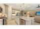 Modern kitchen with white cabinets, granite countertops and stainless steel appliances at 4730 Zeno Ct, Bradenton, FL 34211