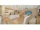 Open kitchen with stainless steel appliances and an island at 4730 Zeno Ct, Bradenton, FL 34211