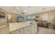 Open concept kitchen with island and stainless steel appliances at 4730 Zeno Ct, Bradenton, FL 34211